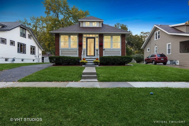 view of front of home with a front yard