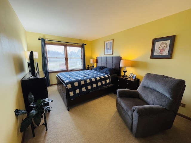 bedroom featuring light carpet