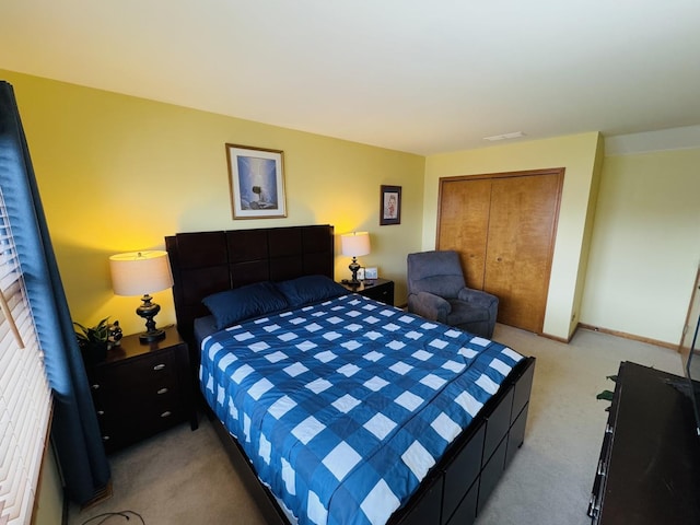 carpeted bedroom with a closet