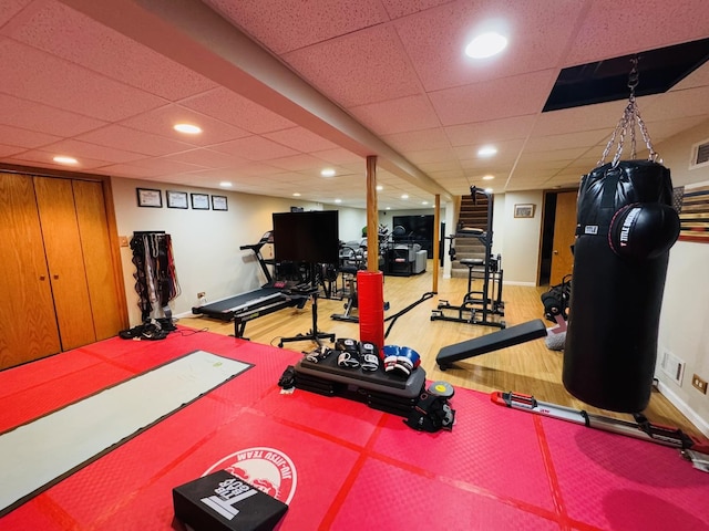 exercise room with hardwood / wood-style floors