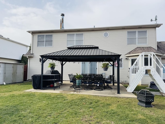 rear view of property featuring a gazebo, a patio, a shed, and a yard