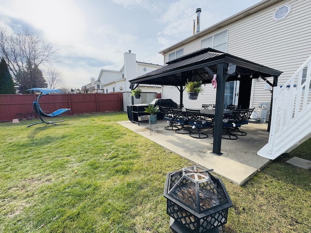 view of yard featuring a gazebo, an outdoor fire pit, and a patio area