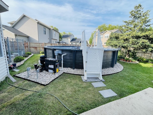 view of yard featuring a fenced in pool