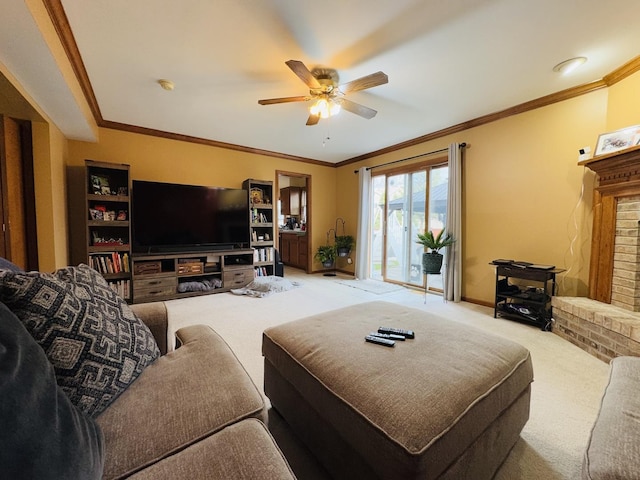 carpeted living room with ceiling fan, crown molding, and a brick fireplace