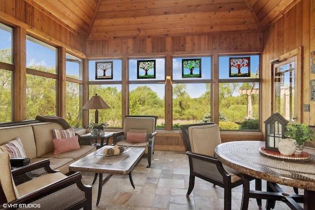 sunroom featuring vaulted ceiling and wood ceiling