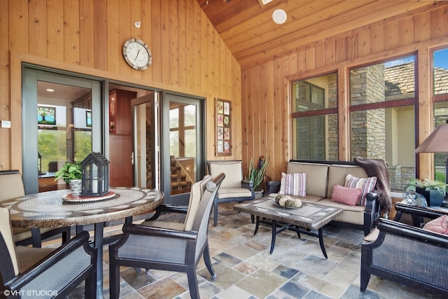 sunroom featuring wood ceiling and lofted ceiling