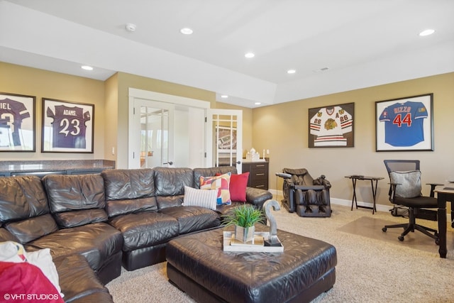 carpeted living room with french doors