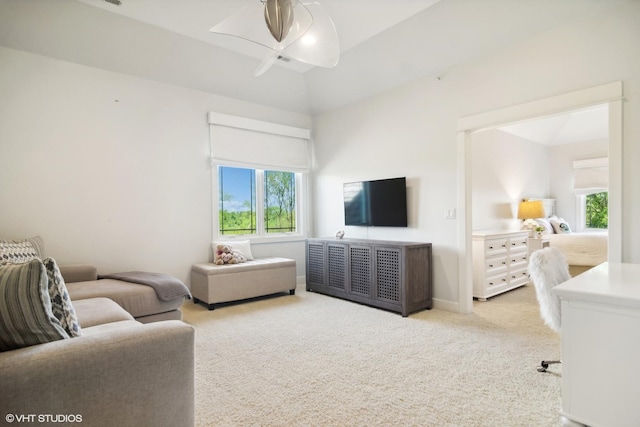 living room featuring light colored carpet and lofted ceiling