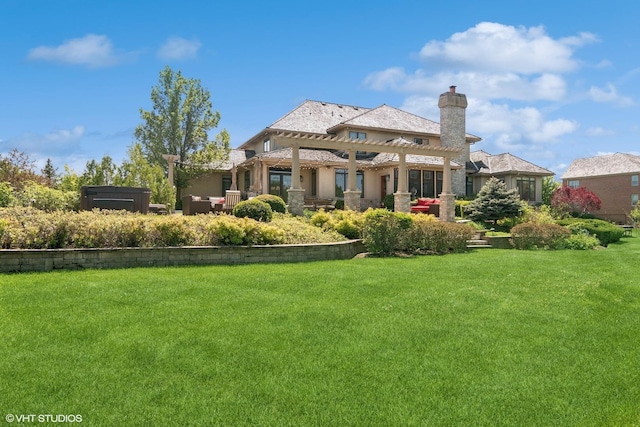 rear view of house featuring a lawn and an outdoor living space