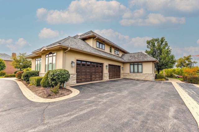 prairie-style home featuring a garage