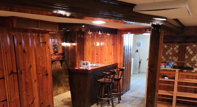 bar with wooden walls and light carpet