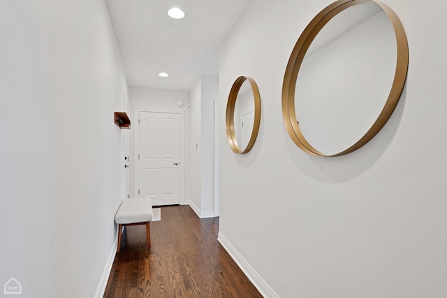 hallway with dark wood-type flooring