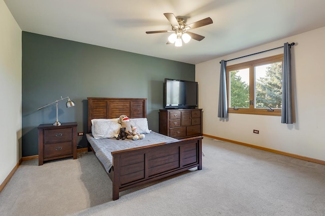 bedroom with ceiling fan and light colored carpet