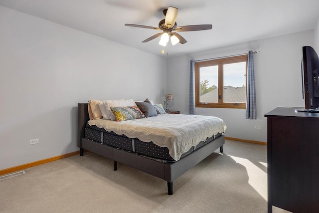 bedroom featuring ceiling fan and light colored carpet