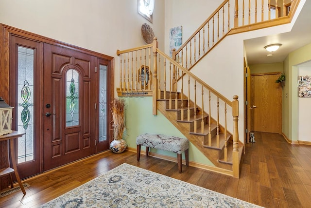 foyer with wood-type flooring and plenty of natural light