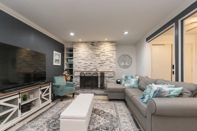 living room with a fireplace, built in shelves, and ornamental molding