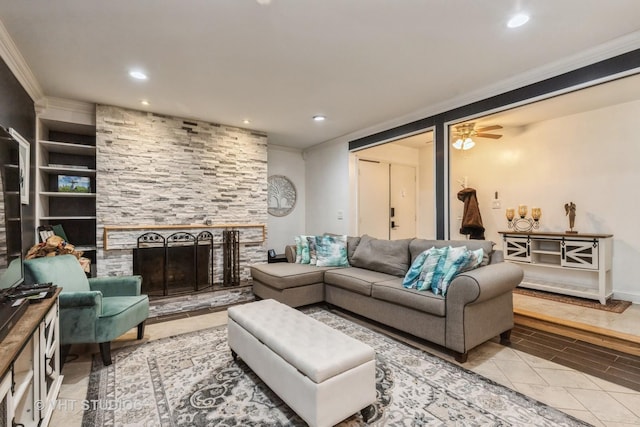 tiled living room featuring ceiling fan, a fireplace, built in features, and ornamental molding