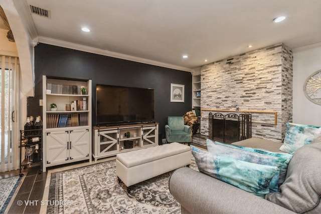 tiled living room with a fireplace and ornamental molding