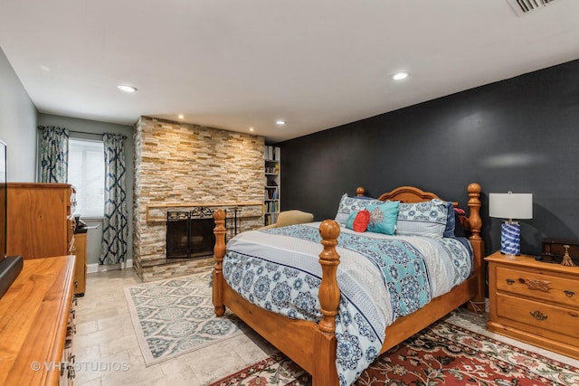 bedroom featuring a fireplace