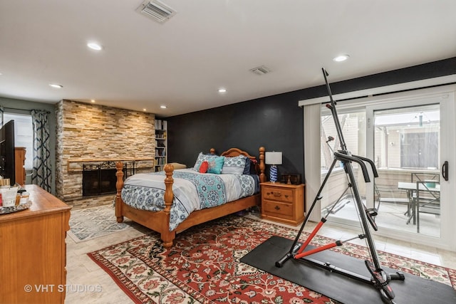 bedroom with a stone fireplace