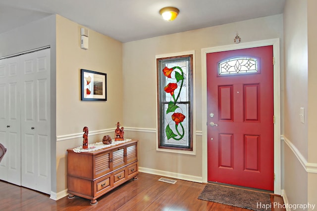 entrance foyer with dark hardwood / wood-style flooring