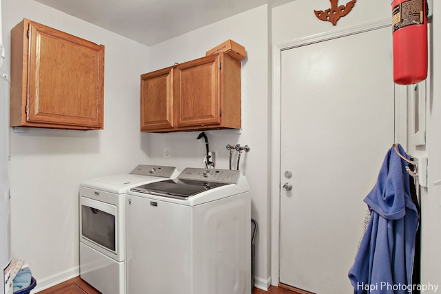 laundry room featuring cabinets and independent washer and dryer