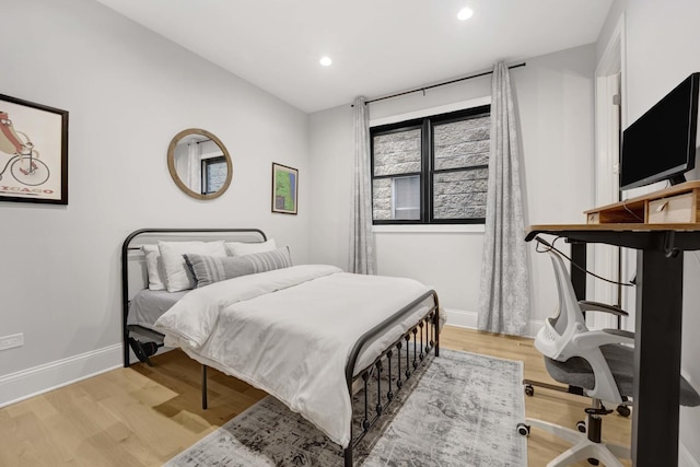 bedroom with light hardwood / wood-style flooring