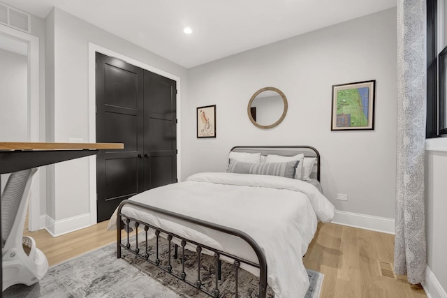 bedroom featuring light hardwood / wood-style floors