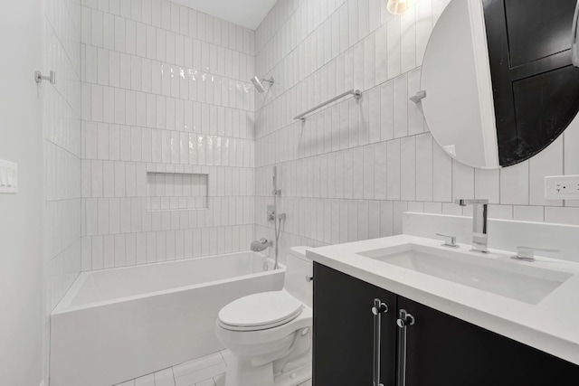 full bathroom featuring toilet, tasteful backsplash, tile walls, vanity, and tiled shower / bath combo