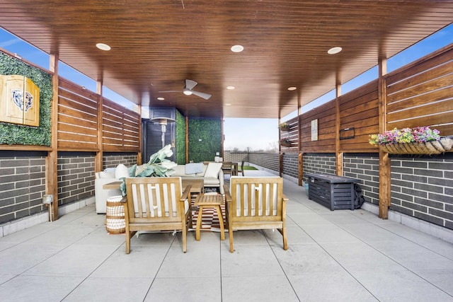 view of patio featuring an outdoor living space and ceiling fan