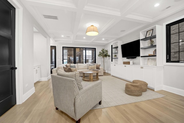 living room featuring coffered ceiling, beam ceiling, and light hardwood / wood-style floors