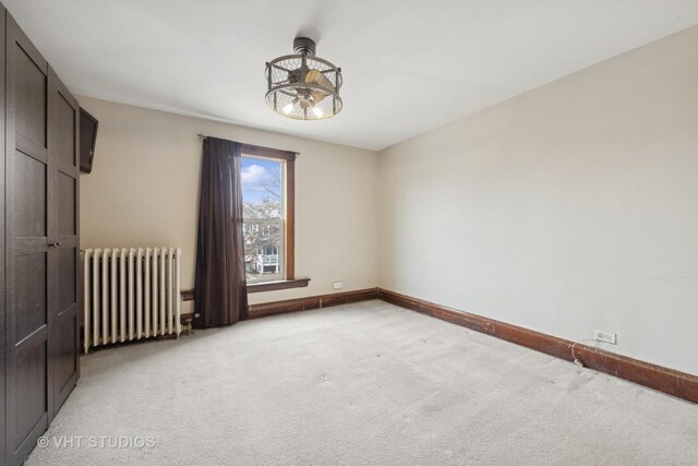 empty room with light colored carpet