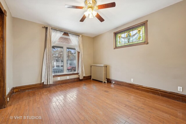 unfurnished room featuring ceiling fan and light wood-type flooring