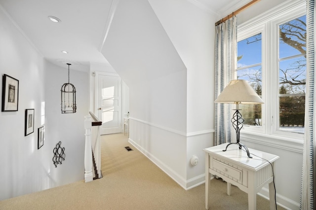 hallway featuring recessed lighting, light carpet, visible vents, an upstairs landing, and baseboards