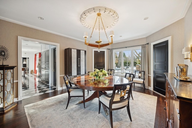 dining space with baseboards, ornamental molding, and dark wood finished floors