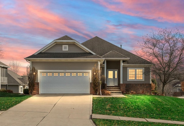 craftsman-style house with a lawn and a garage