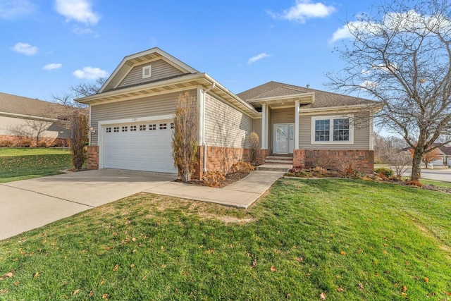 view of front facade with a garage and a front lawn