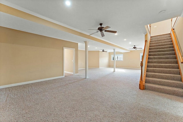 basement featuring crown molding and carpet