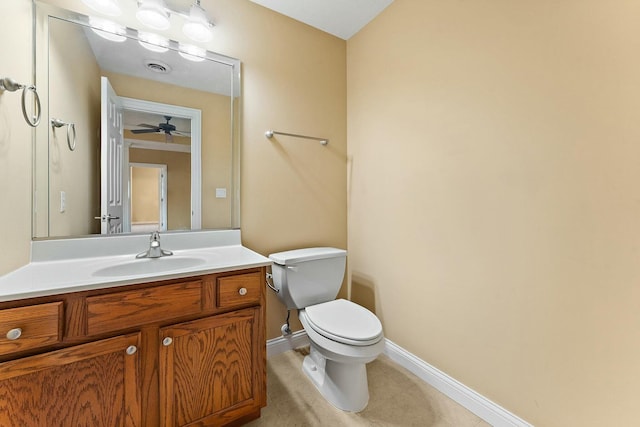 bathroom featuring vanity, toilet, and ceiling fan