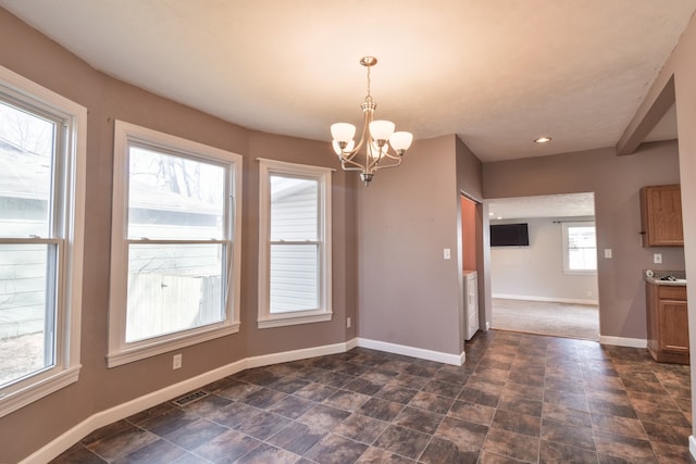 unfurnished dining area featuring visible vents, baseboards, a chandelier, and recessed lighting