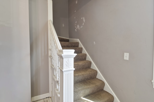 stairs featuring baseboards