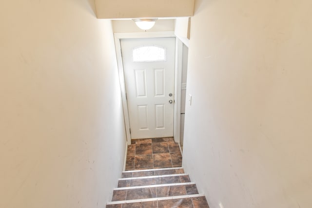 staircase with stone finish flooring