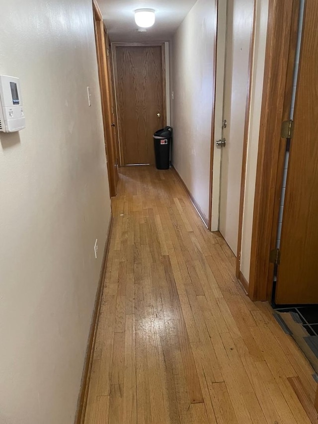 corridor featuring light hardwood / wood-style floors