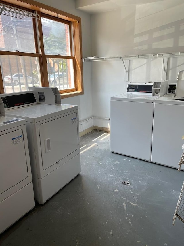 washroom with independent washer and dryer