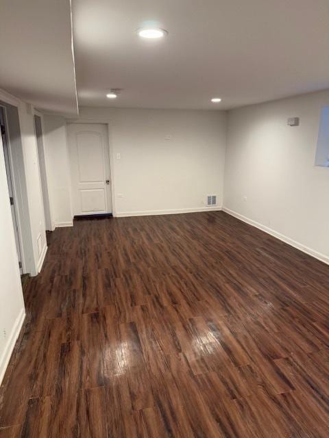 basement featuring dark wood-type flooring