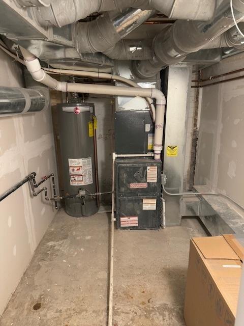 utility room featuring water heater