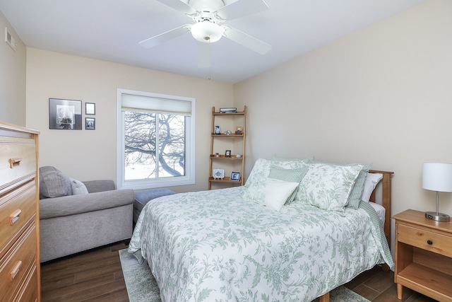 bedroom with ceiling fan and dark hardwood / wood-style floors