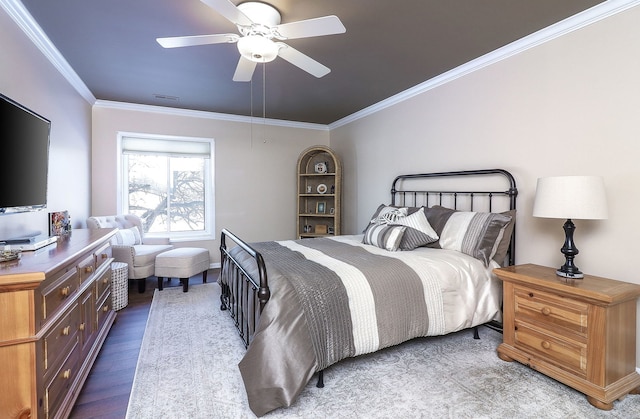 bedroom with ceiling fan, crown molding, and wood-type flooring