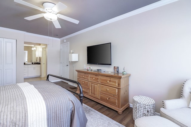 bedroom featuring ceiling fan, dark wood-type flooring, crown molding, and connected bathroom