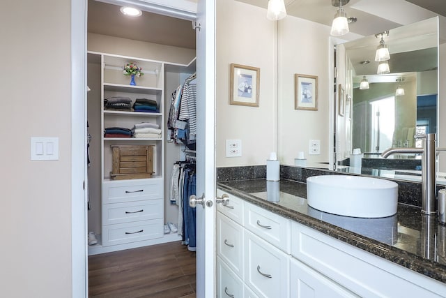 bathroom featuring wood-type flooring and vanity